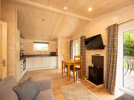 Light and stylish open plan lounge, dining and kitchen area