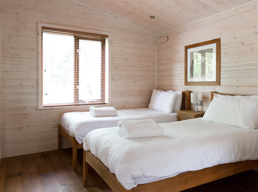 Comforatvle twin bedroom with crisp white bedding