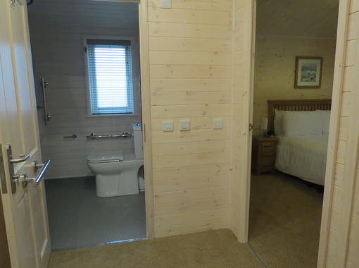 Hall way showing space for wheelchair access to the wet room and double bedroom