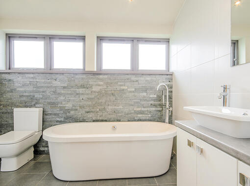 Spacious family bathroom with freestanding bath