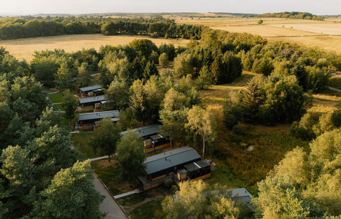 Modern lodge with large decking and hot tub