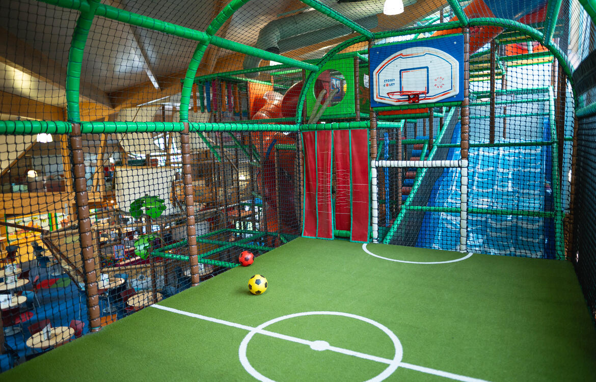 Children playing in the court area with basketball