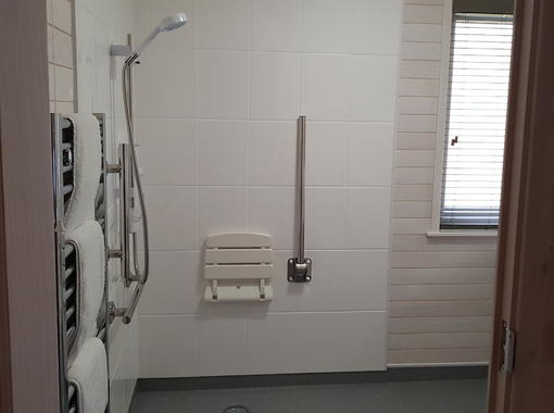 Wet room with drop down seat in shower