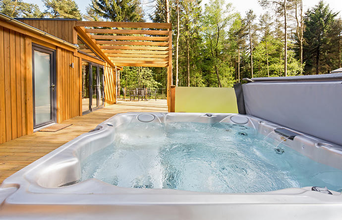 Huge hot tub  with trees behind