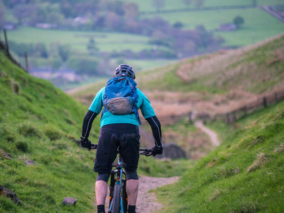 Cycling down a path in between two hills