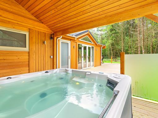 Outdoor hot tub under wooden canopy