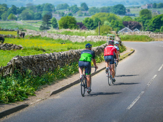 2 cyclists travelling along a road