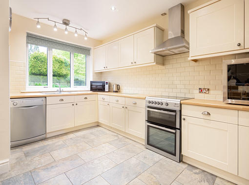 Spacious kitchen area with dining table