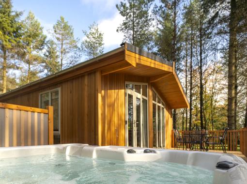 View of lodge exterior from bubbling outdoor hot tub 